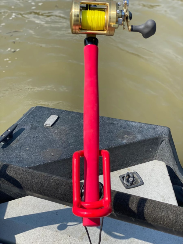 A red pole on the side of a boat.