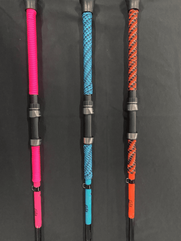 Three different colored poles with a black handle.