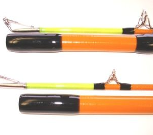 Two orange and black poles with a yellow handle.