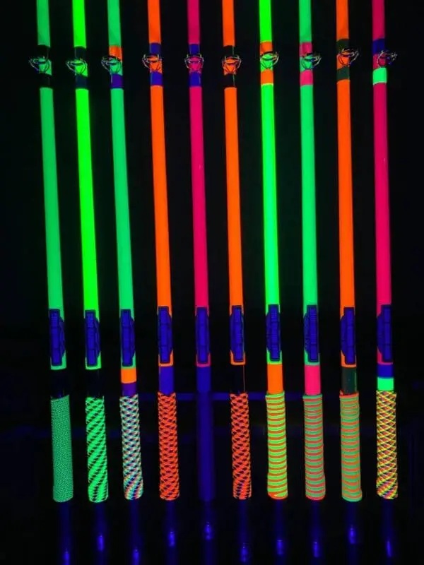 A bunch of neon sticks that are in the dark
