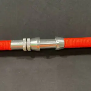 A close up of the end of an orange hose
