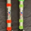 Two pens with different colored caps and writing on them.