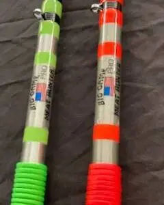 Two pens are shown with different colors of rubber.